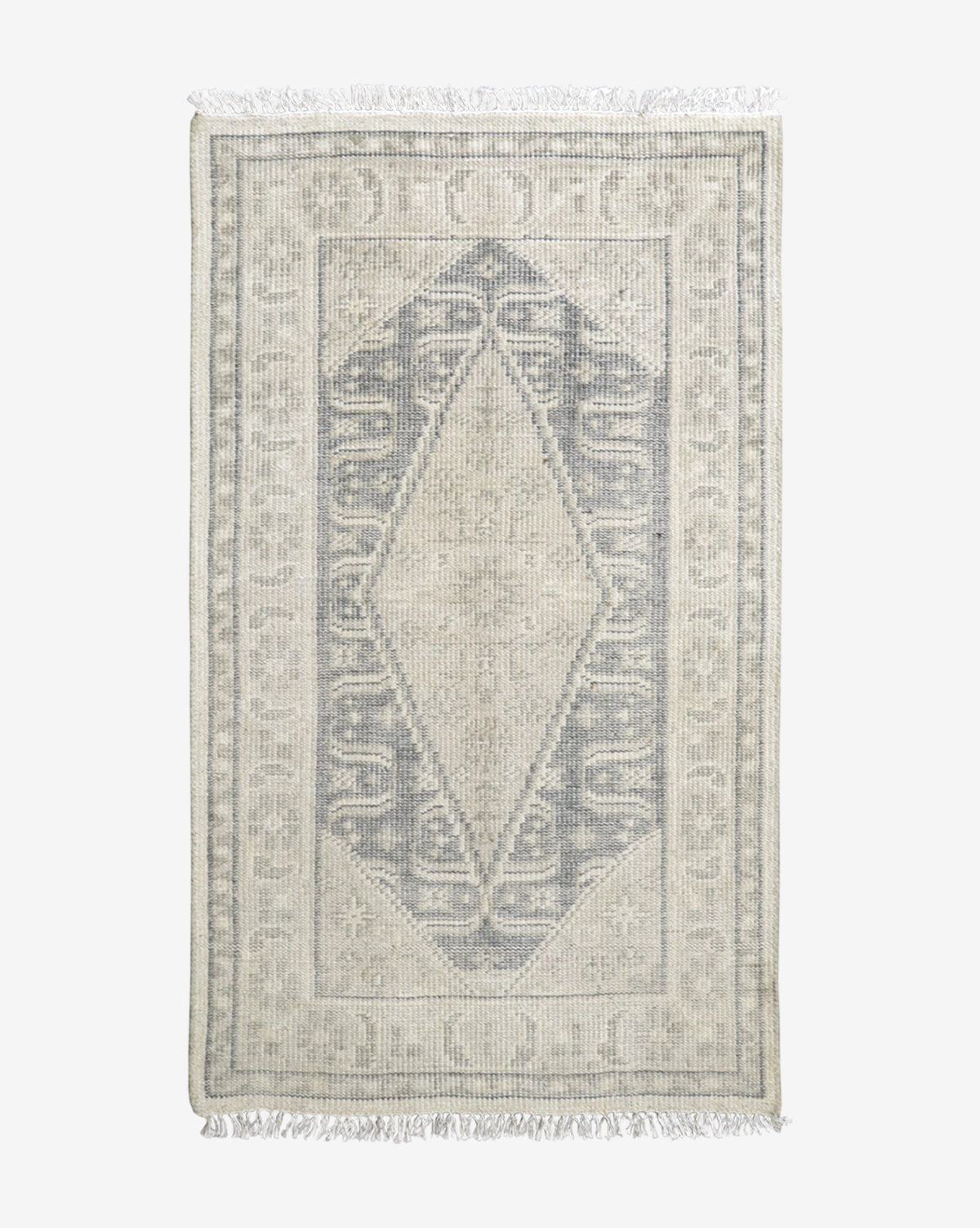 McGee & Co. hand-knotted rug with cream and blue tones