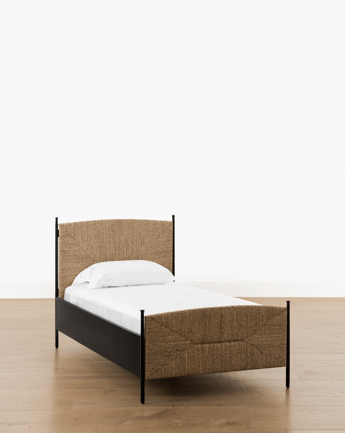 McGee & Co. metal bed frame with seagrass headboard and footboard. 